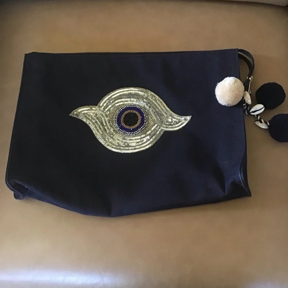 Figue navy blue clutch with sequined evil eye and Pom poms